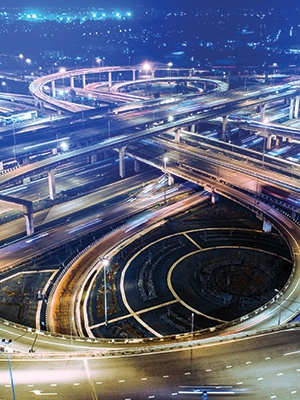 Timelapse aerial photo of traffic on a large highway interchange