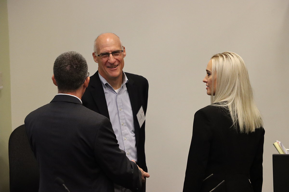 Dave Ginn, OARnet deputy chief relations officer speaking with Lindsey Farmer, account executive, SHI and Bryan Rosenthal, district sales manager, SHI at Fall 2022 OARnet Member Meeting