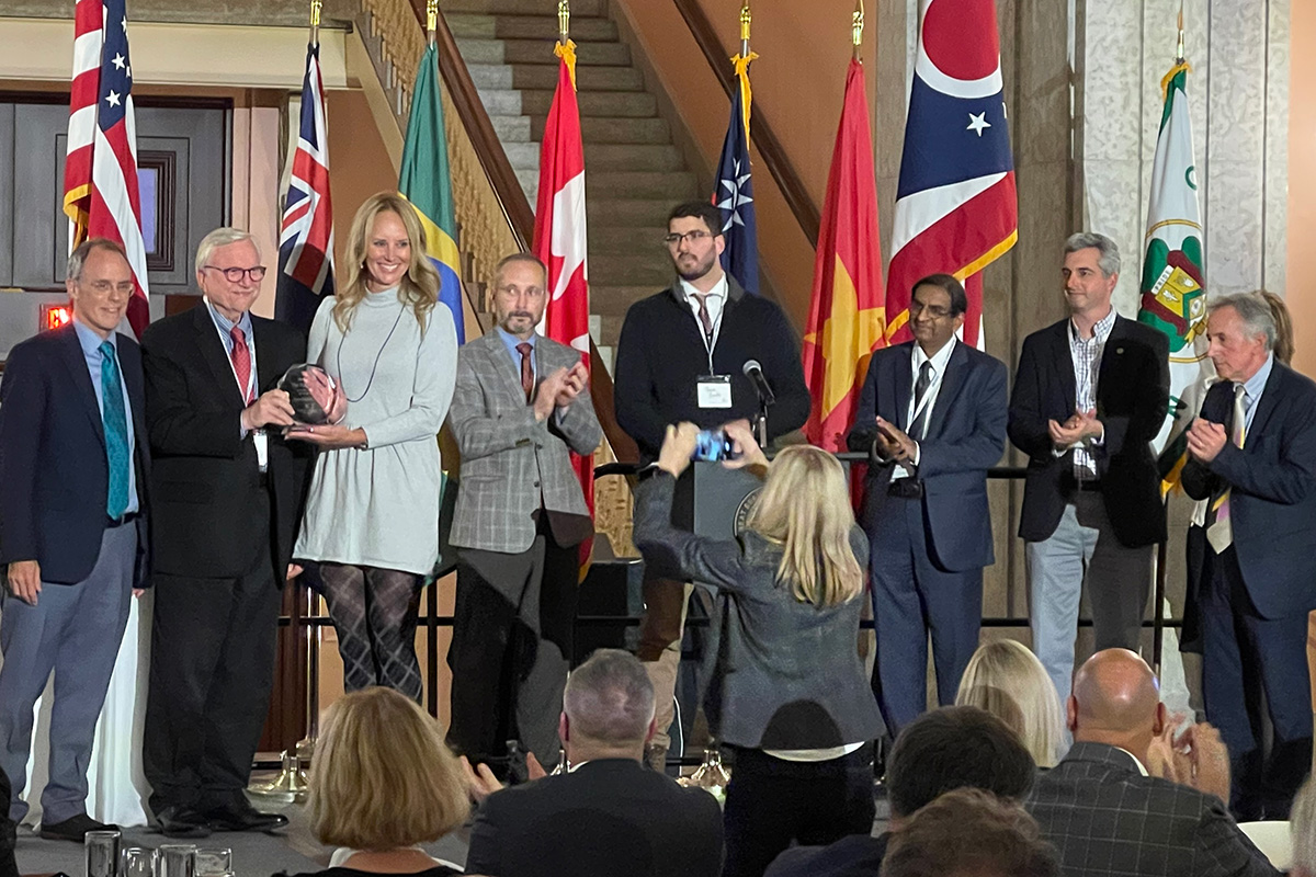 Lydia Mihalik, director of the Ohio Department of Development, accepts the Intellient Community Forum's Intelligent State award on behalf of the state, joined by OARnet Exective Director Pankaj Shah (third from right).
