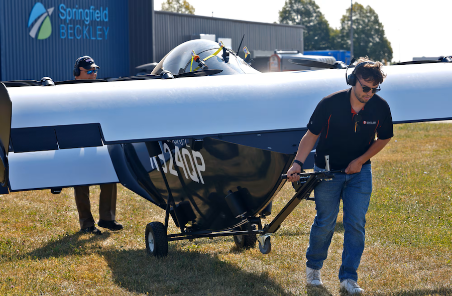 Two people working with the Pivotal Blackfly AAM aircraft 