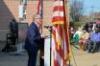 Ohio Governor Mike DeWine speaks from a lectern outside Mayfair Elementary School in East Cleveland, Ohio, on Wednesday, April 7, 2021.